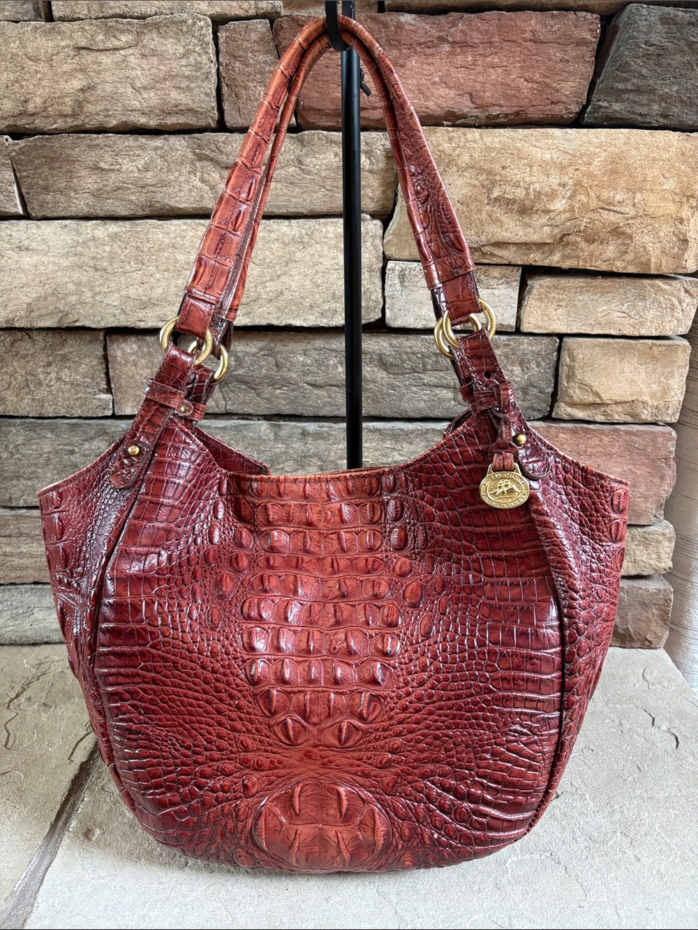Brahmin brown leather shoulder bag with gold accents